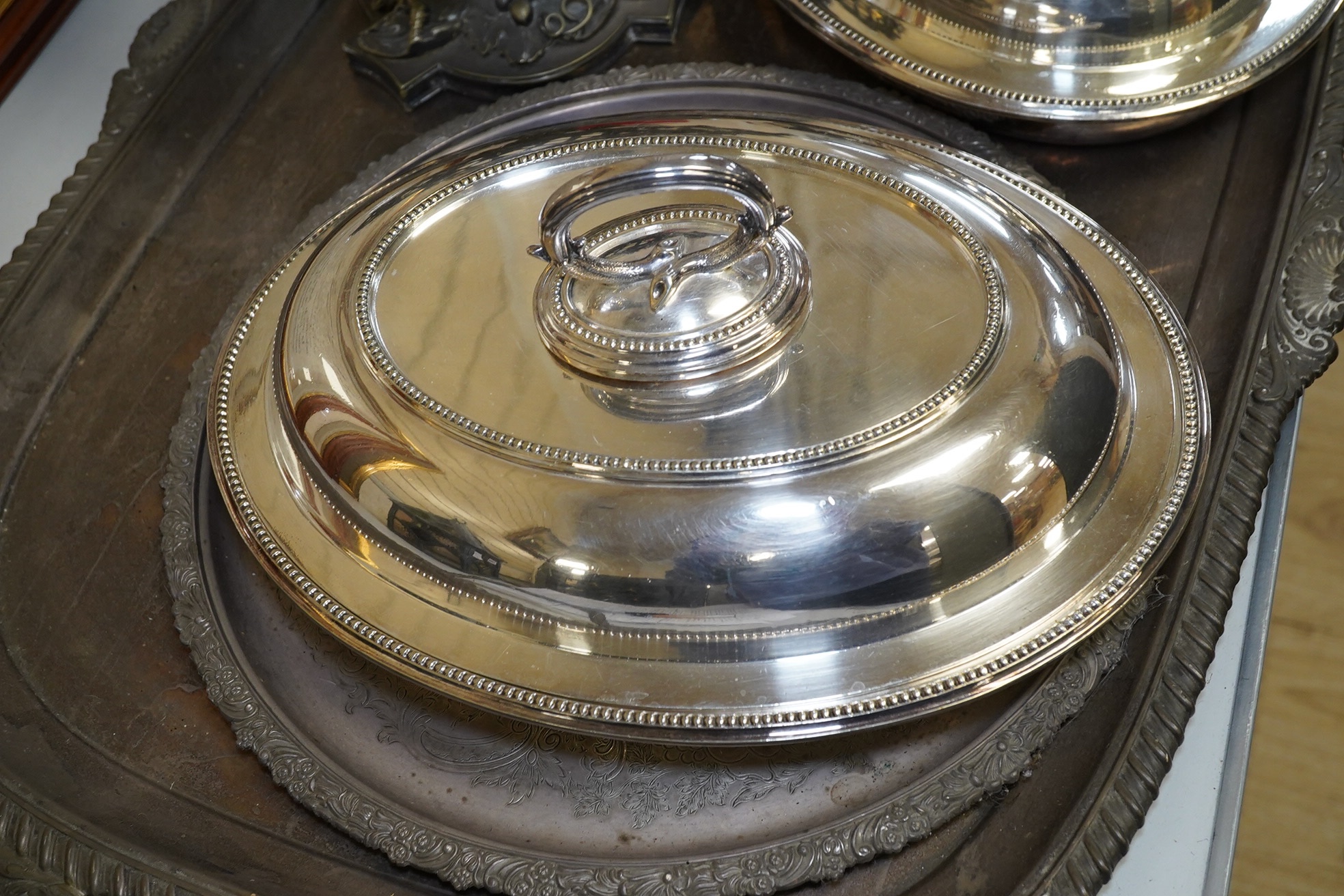 A plated tray and salver, entree dishes and a vineous pedestal dish, tray 76cm wide. Condition - tray and salver plate worn